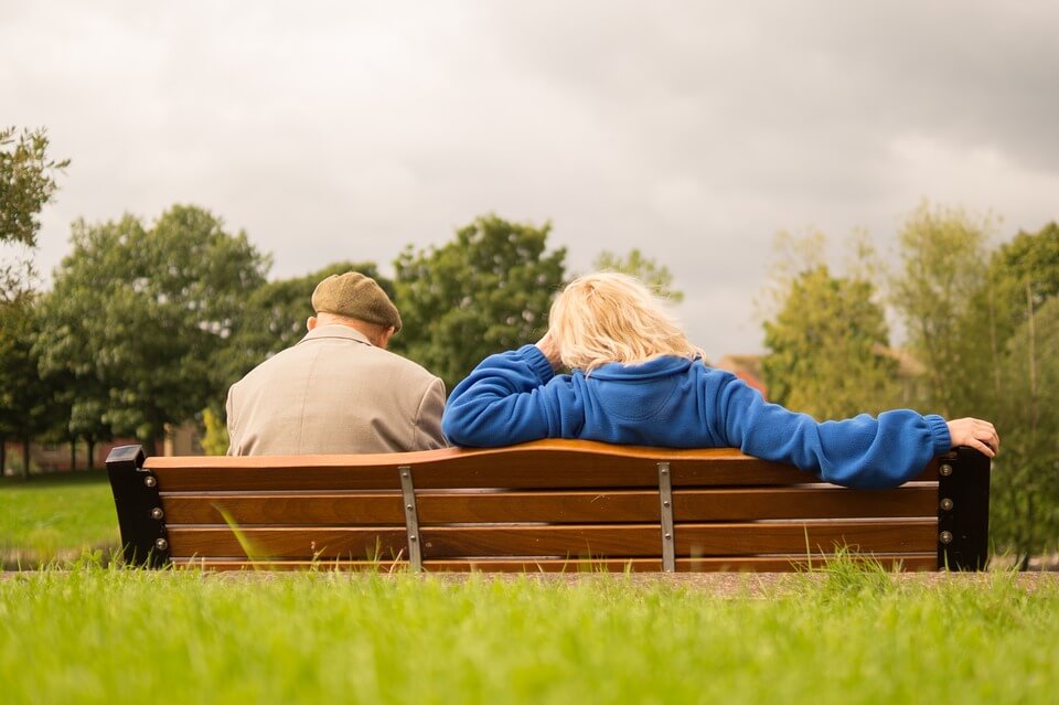 Family Seating on a Bench at Park