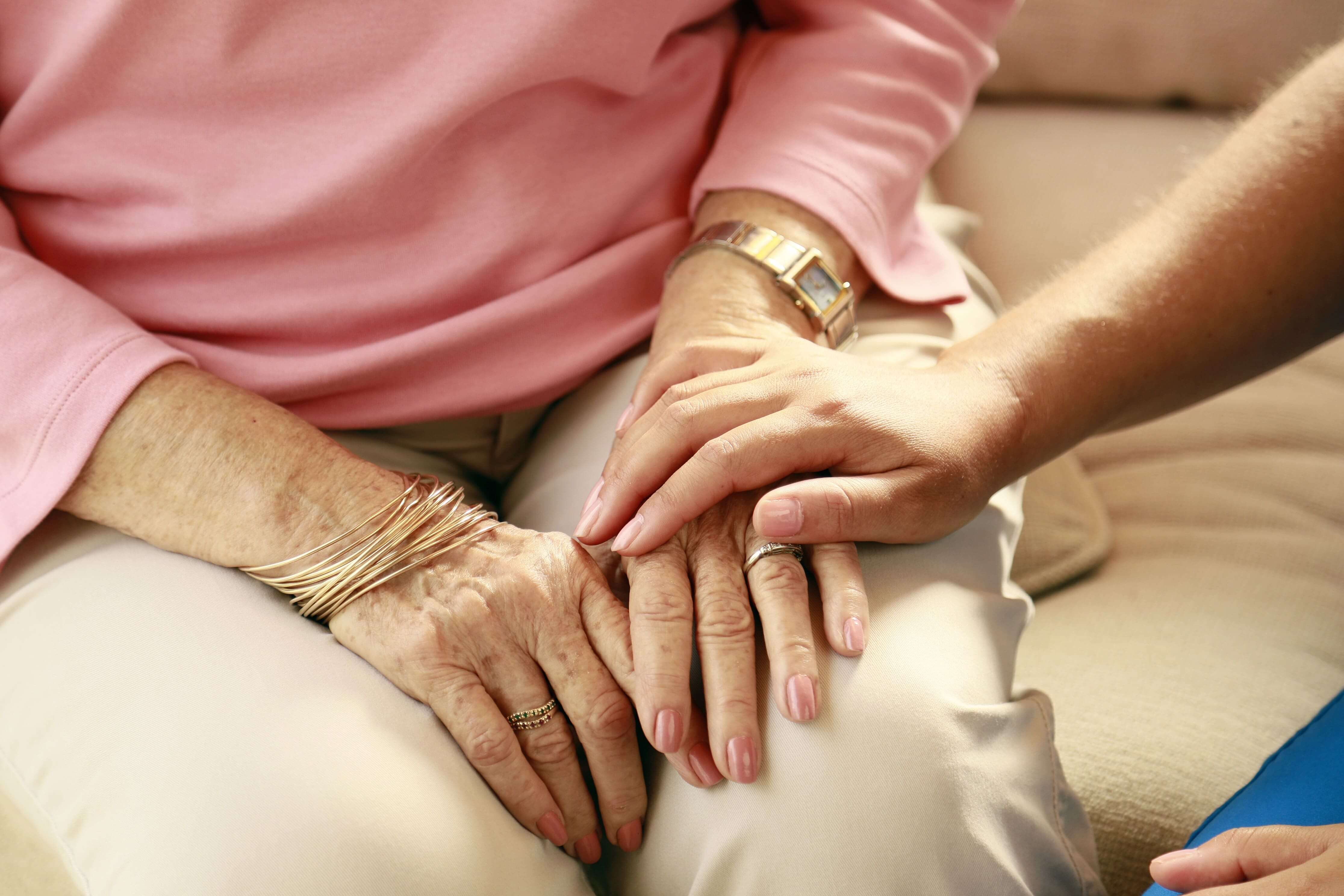 Nurse Holding Hands of a Patient