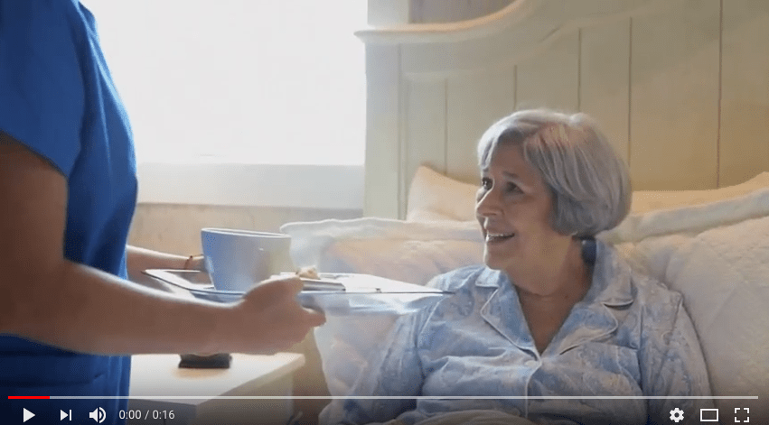 Nurse Giving Breakfast to a Patient