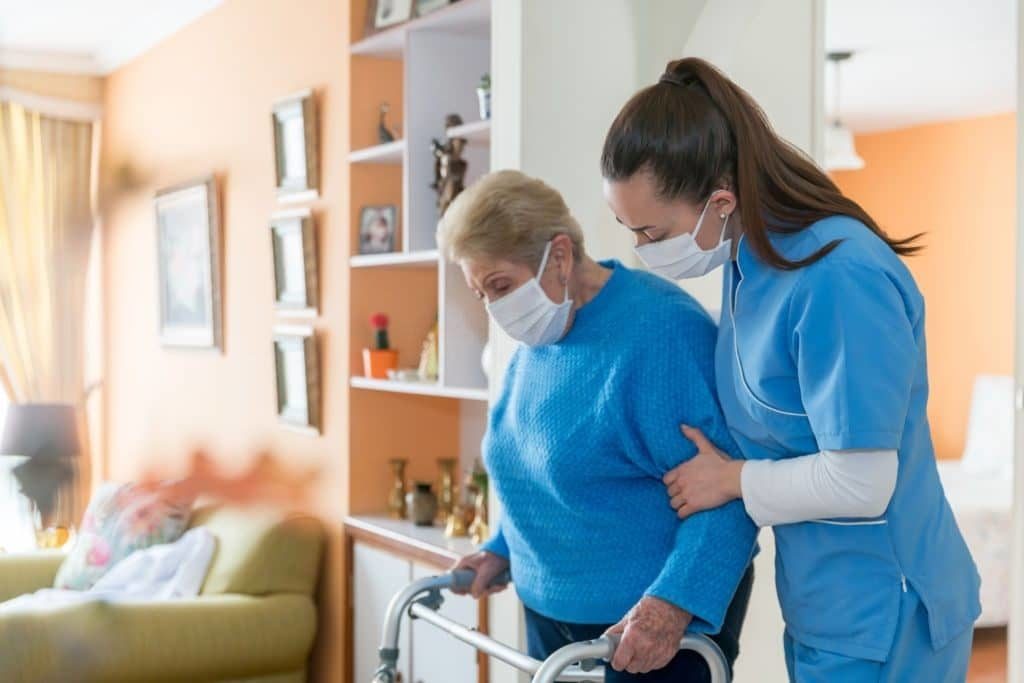 Nurse Helping Elder Women to Walk