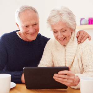 Two Couples Playing Games on a Laptop